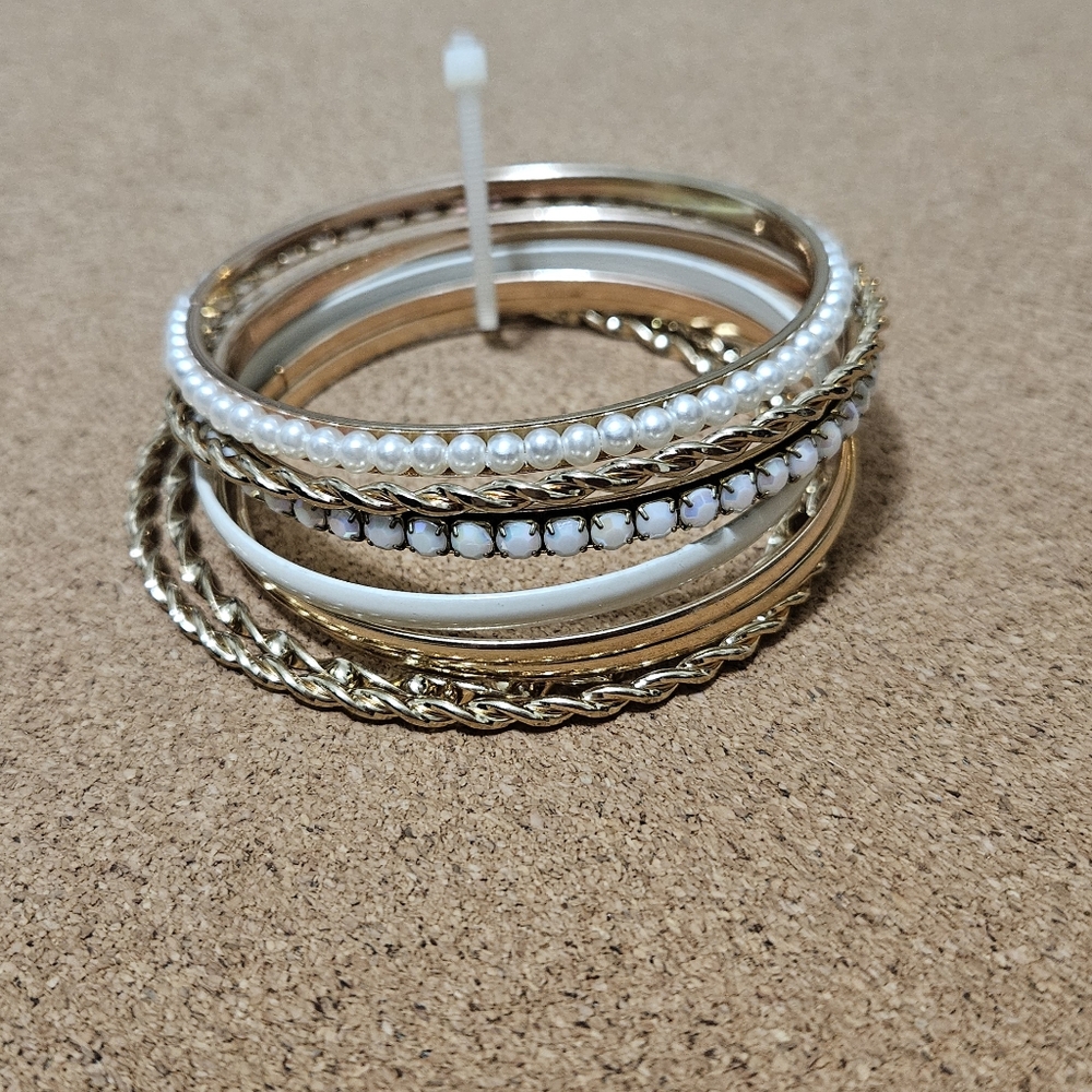 Gold colored bangles with pearls
